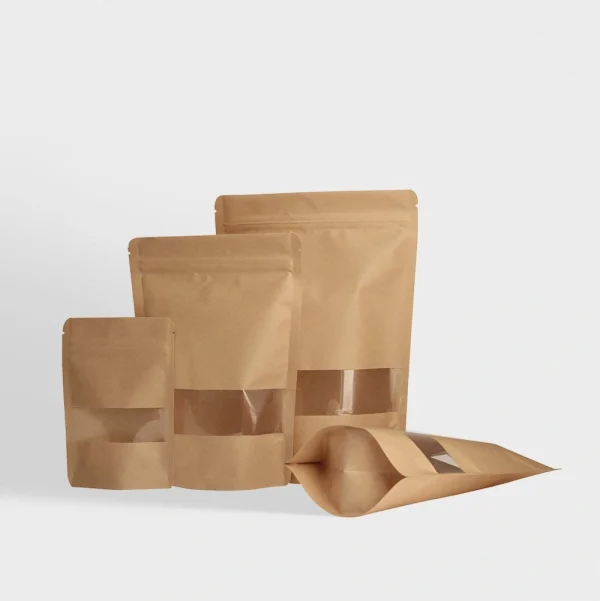 Kraft stand-up pouches with a clear window, ideal for showcasing and packaging food and retail products.