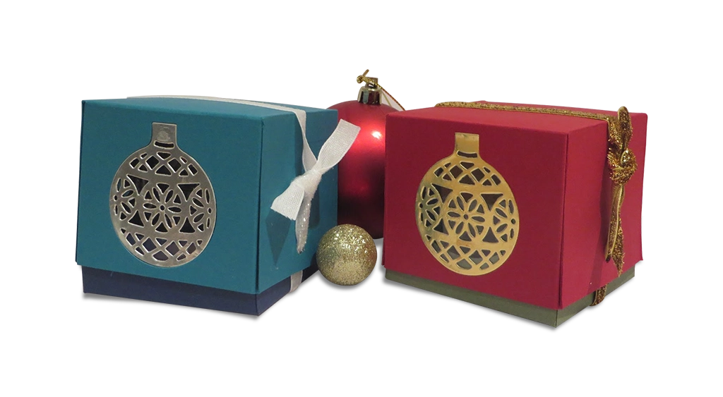 Custom printed ornament boxes in blue and red with metallic festive designs, ideal for Christmas gift packaging.